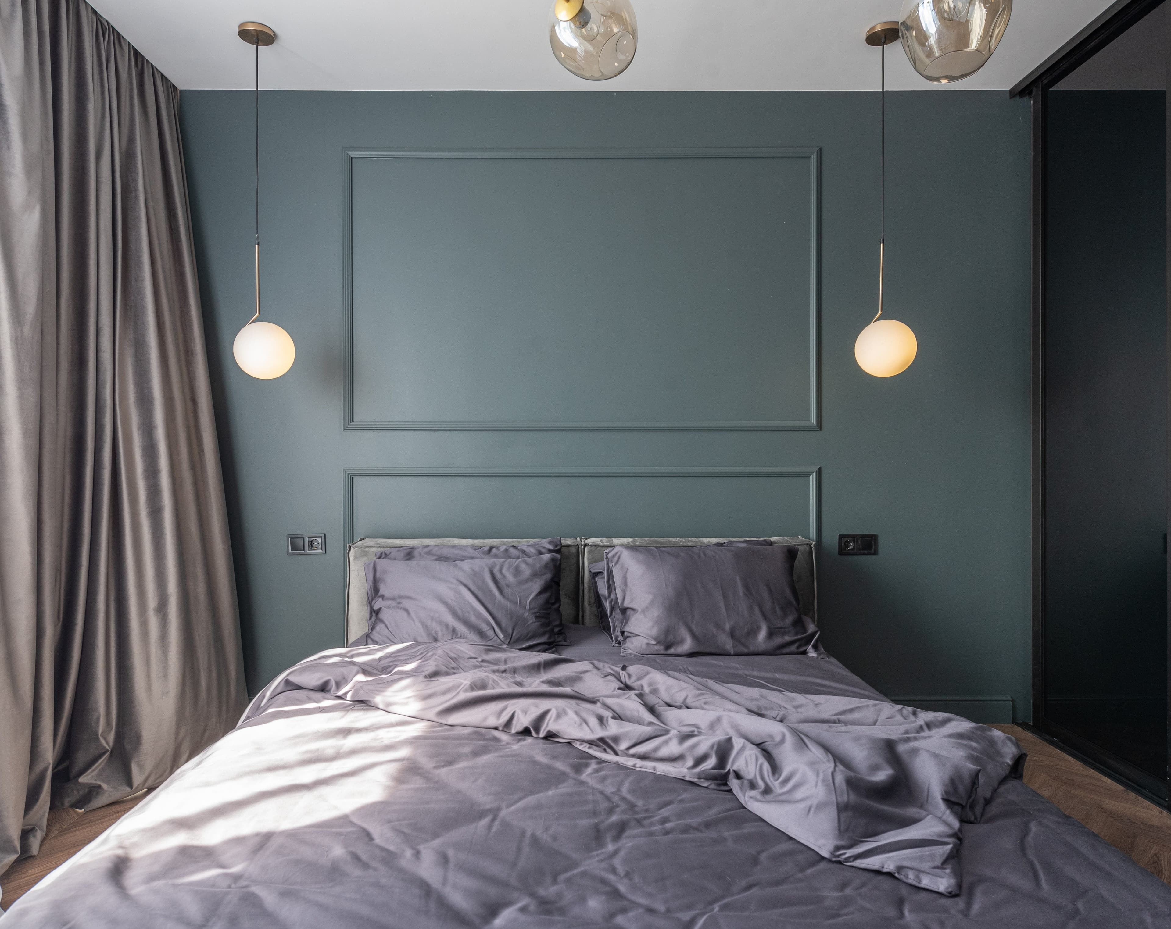 Softly lit bedroom with an unmade double bed, the private setting for decisions about contraception.